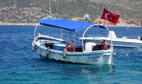 Small Turkish boat crossing Kalkan bay to Patara Prince