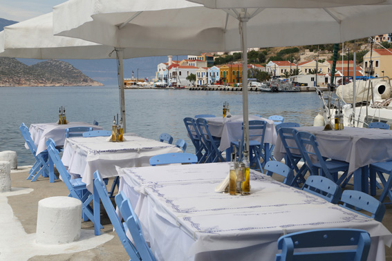 Pretty restaurants line the water's edge at Meis harbour