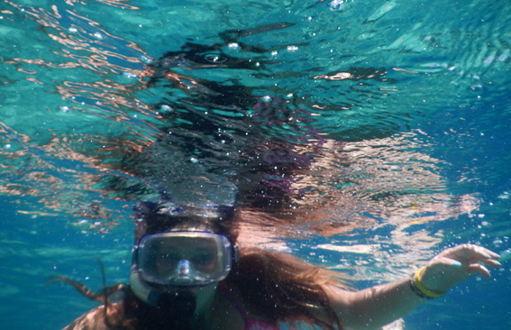 Girl underwater with mask and snorkel
